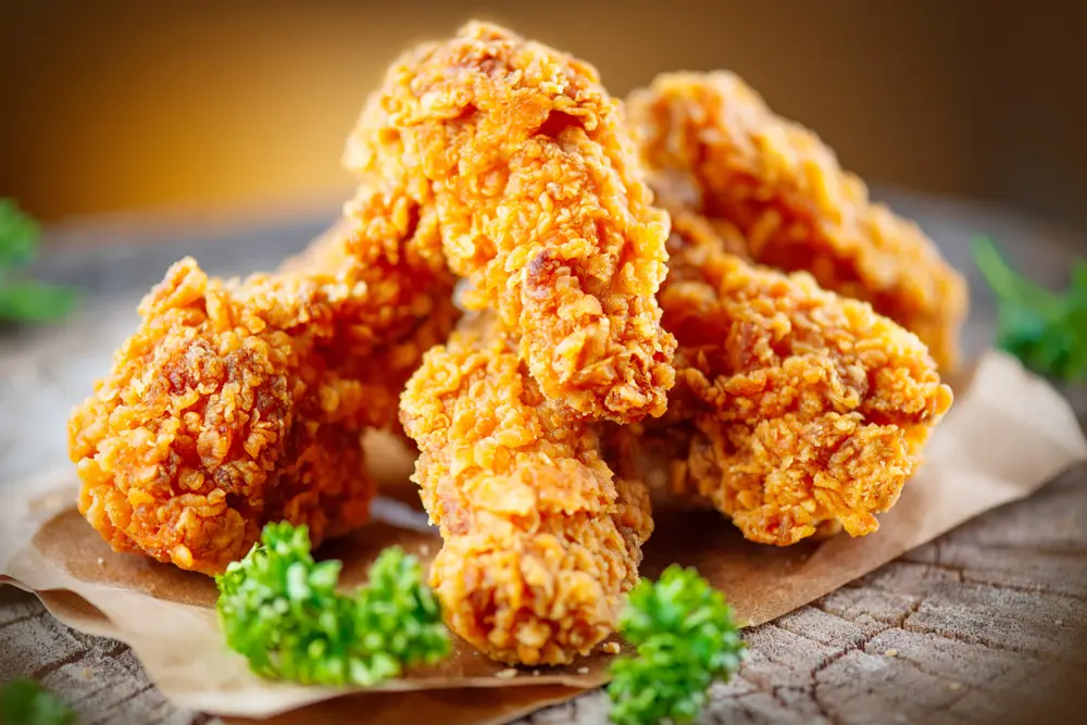 <b>El Pollo Frito: Una Explosión de Sabor y Publicidad</b> - Cuál es el origen del pollo frito pollo frito publicidad - Cuál es el origen del pollo frito